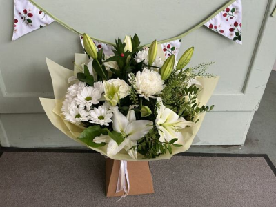 Evelyn - A fabulous collection of white and cream flowers make this the perfect gift. This bouquet will be hand delivered by the local florist.