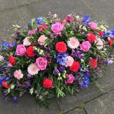 Country Double Ended Coffin Spray - A gorgeous selection of country garden flowers arranged in oasis. 

*please note flowers maybe vary due to seasonal availability