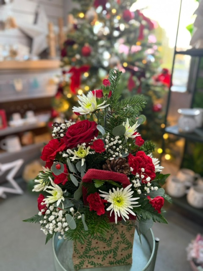 Scarlet & Snow - A festive favourite with timeless appeal, Scarlet & Snow blends rich seasonal reds with crisp white tones and fresh greenery. Presented in a charming gift bag, this rustic yet elegant design captures the warmth and wonder of Christmas giving.