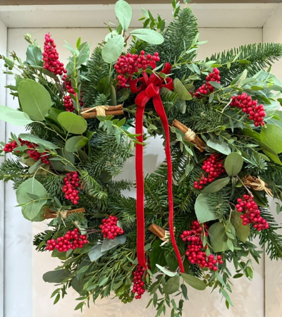 'Santa Claus' Luxury Door Wreath - A luxurious spruce wreath with berried ivy and eucalyptus. Decorated with artificial berries and twine wrapped cinnamon - finished off with a red velvet ribbon. Handmade by us at The Flower Cabin.
